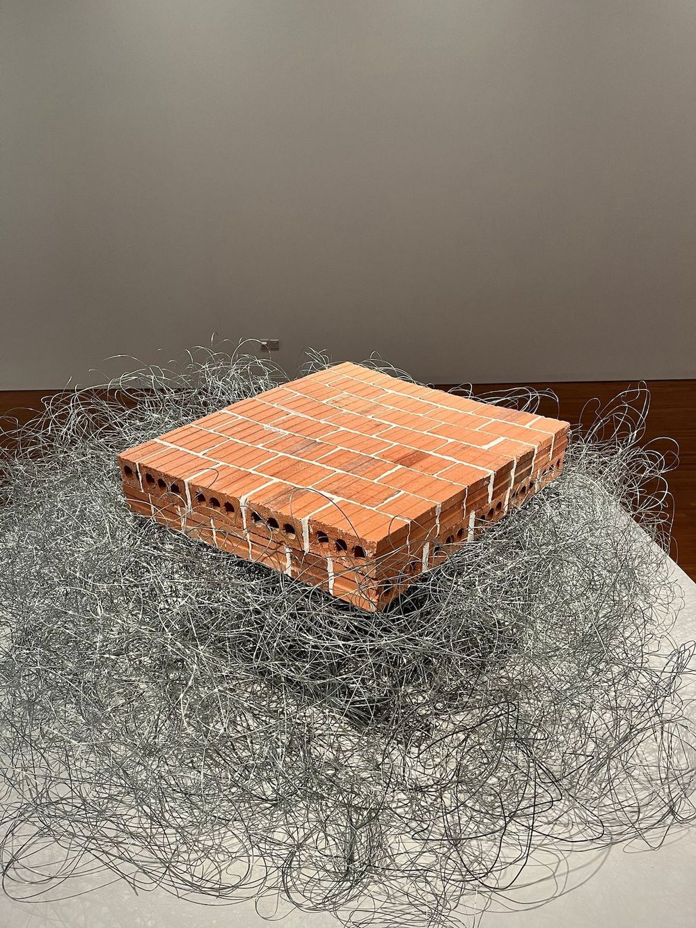 Tang Da Wu, ‘Cloud of ‘68’, 1971 remade 2022, bricks, barb wire, steel wire and metal plates, dimensions variable. Collection of the artist. Image courtesy of National Gallery Singapore.