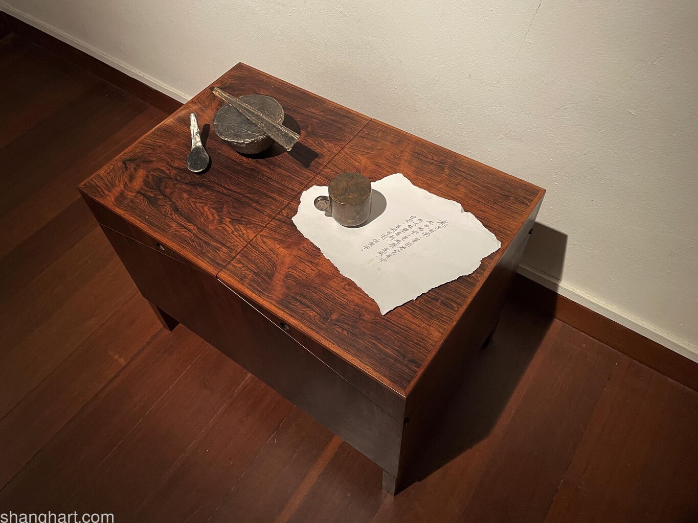 [left to right] Tang Da Wu, 'Useless Things, Spoon', 1971 (remade 2022), tin, 5 x 13 x 4.5 cm; 'Useless Things, Ricebowl', 1971 (remade 2022), tin, 6.5 x 14 x 14 cm; 'Useless Things, Chopsticks', 1971 (remade 2022), tin, 0.5 x 14 x 4.5 cm; 'Useless Things, Teacup', 1971, bronze, 7 x 9.5 x 7 cm. Image courtesy of the artist and Art Agenda.