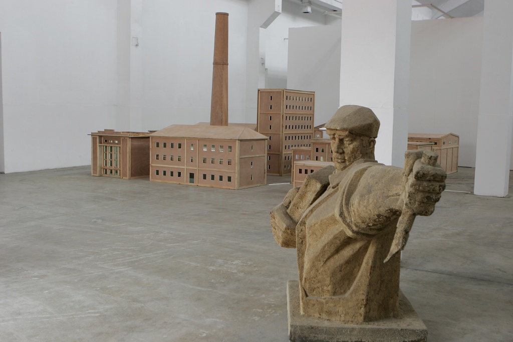 (Left) Shi Qing-Factory, (Right) Wang Guangyi-The Materialist